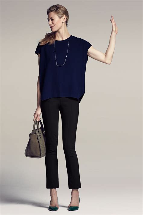 navy pants with black top.